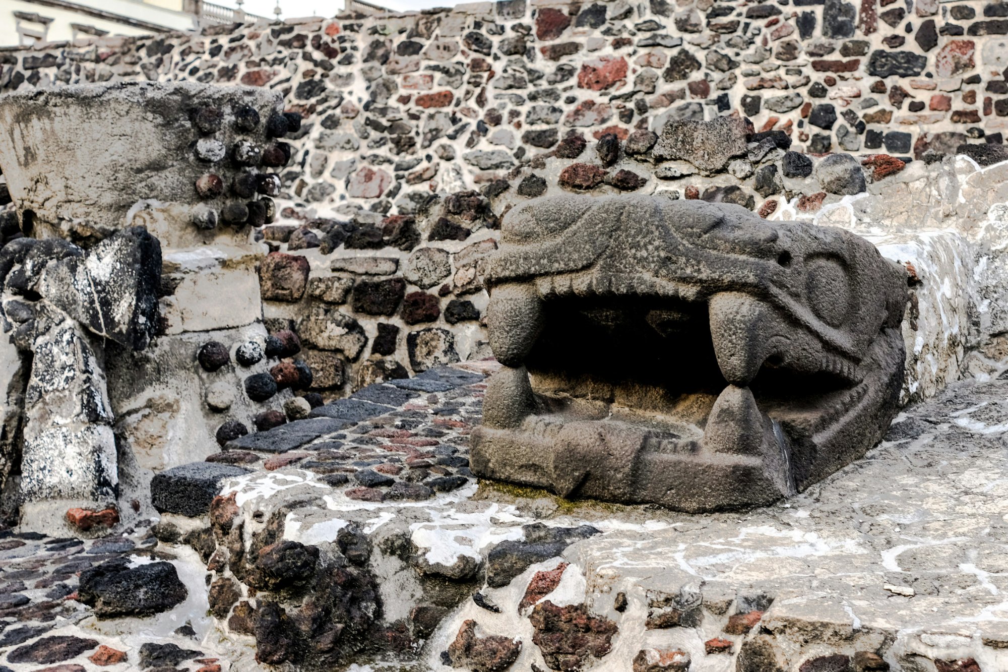 Ancient Aztec serpent stone carving — gateway between the dream world and Mictlan