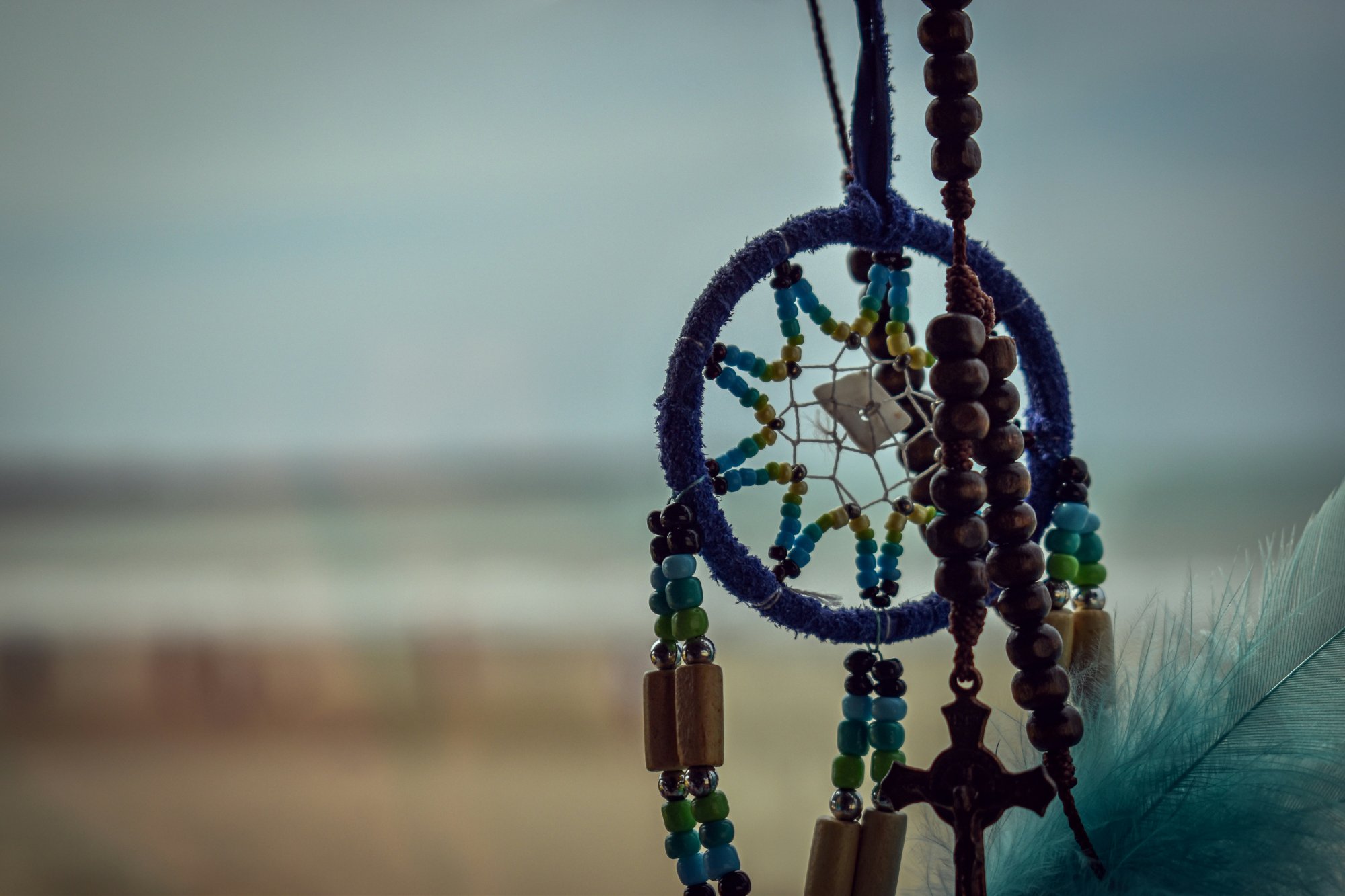 Dreamcatcher with beads and feathers — the Ojibwe tradition of filtering dreams