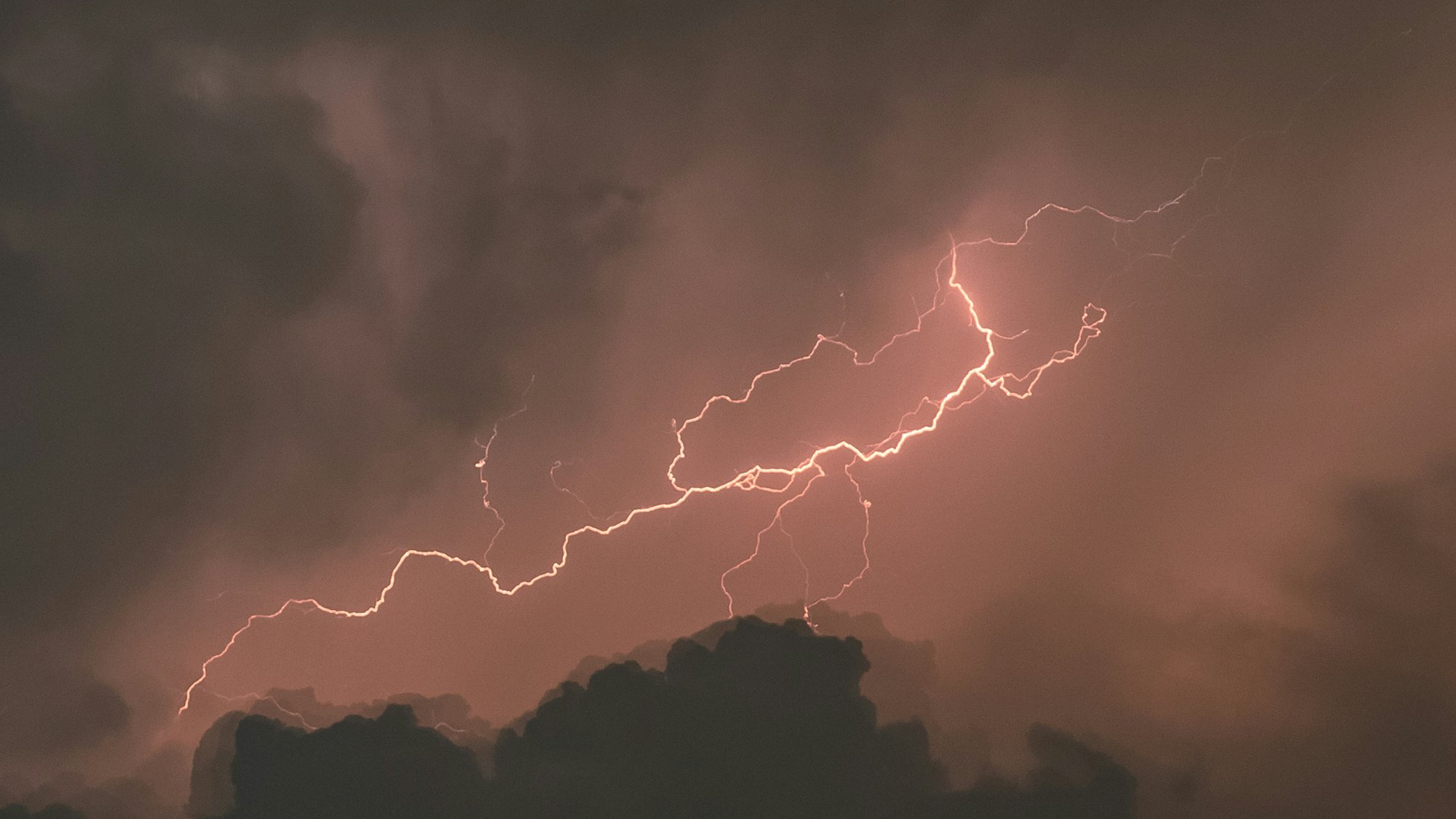 Lightning illuminating storm clouds — a flash of knowledge from darkness